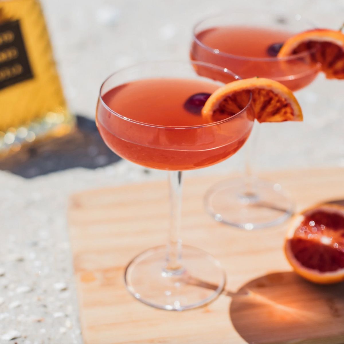 In the twilight of a sun-kissed beach, the Solento Sunset cocktail was crafted. Solento Añejo intertwines with the lusciousness of blood orange, sparkling with effervescent mineral water. Its garnish, a vibrant slice of blood orange and a Luxardo cherry, mirrors the enchanting hues of the setting sun, bringing a touch of elegance to this captivating libation.